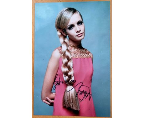 Model Twiggy Lawson signed superb colour 12 x 8 pink dress portrait photo. Good condition. All autographs are genuine hand si