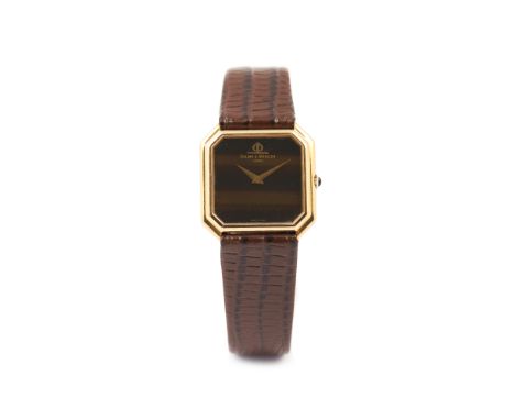 Baume &amp; MércierModel with the ref. nº 38260. Winding mechanical movement (Cal. 777). Tiger eye dial. Yellow gold case (75
