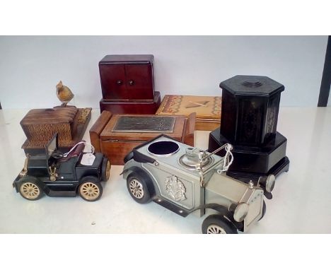 Seven vintage cigarette dispenser, to include examples in the form of vintage cars, a bakelite example, art deco example, can