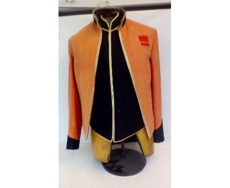 Vintage mannequin torso with military scarlet tunic 