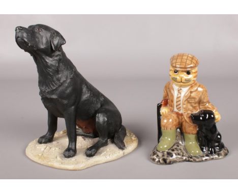 A large border fine art figure of a Labrador by Margaret Turner along with another ceramic figure.  