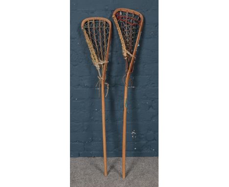 Two vintage wooden Lacrosse sticks.  