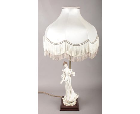 A Capodimonte figural table lamp of a woman.  