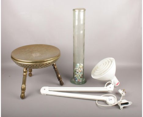 A group of assorted items. To include a Luxo adjustable desk-clamped work lamp, a tall glass spaghetti jar with marbles and a