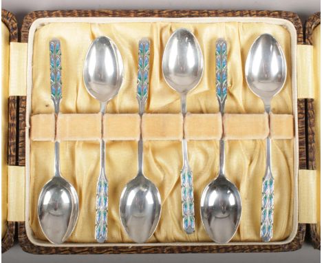 A cased set of six Liberty &amp; Co silver and enamel teaspoons. Assayed Birmingham 1928.  