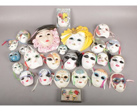 A box of ornate painted ceramic masks.  