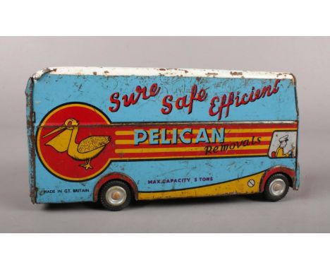 A Mid Century Wells-Brimtoy Tinplate 'Pelican Removals' Van. friction drive.  Missing rear door
