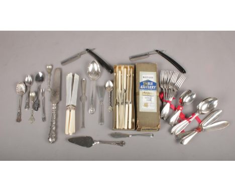 A quantity of mostly Sheffield made flatware. To include two cut throat razers made by T R Cadman &amp; Sons &amp; C Myers &a
