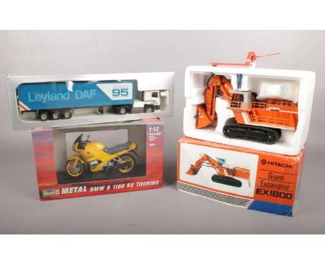 Three boxed die-cast vehicles. To include Hitachi Giant Excavator EX1800, Revell Metal BMW R 1100 RS Turing bike &amp; a Tekn