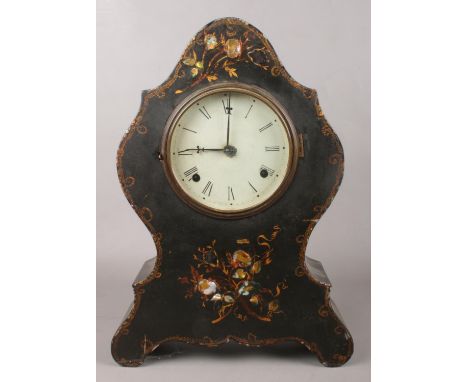 A Chauncey Jerome ebonised eight day mantel clock. With gilt and abalone floral pattern. Chiming on a coiled gong.  No pendul