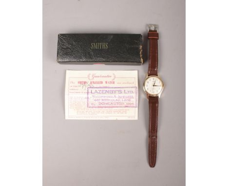 A vintage 'Smiths shockproof' gents wrist watch. To include the original receipt from 1965 and original box.  Condition fair.