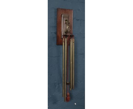 A WT&amp;S brass wind chime. With mahogany wall bracket.  