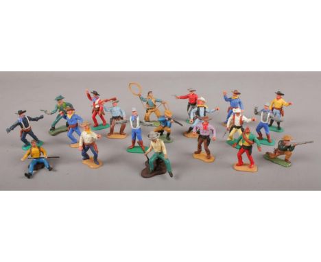 A collection of vintage plastic toy figures. Mainly cowboys, includes Timpo and Britains.  