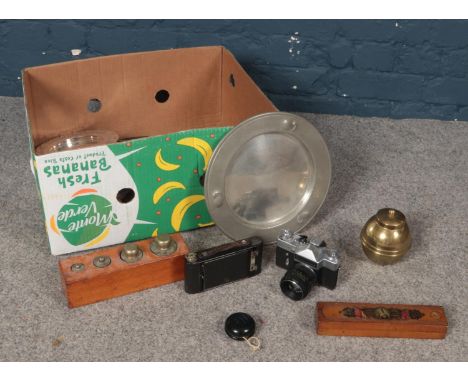 A box of miscellaneous. No.2 Folding Autographic Brownie, Vintage Brass weights, Pewter Tankard &amp; plates etc.  