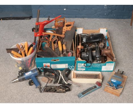 A large collection of tools. Includes power tools, hand tools, bench drill stand, vice etc.  