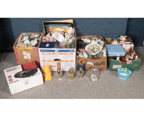 Four boxes of miscellaneous. Including boxed portable record player, glassware, vogue calendar, boxed Regal Collection figure