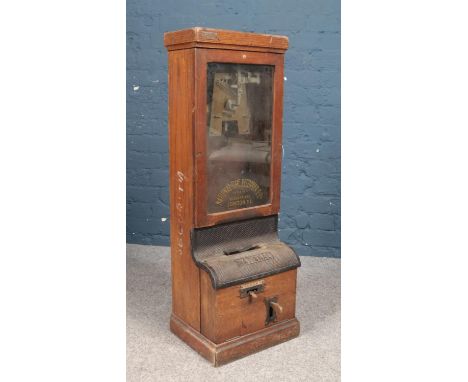 An oak National Time Recorder Co Ltd clocking in clock. Badge for the Air Ministry.  