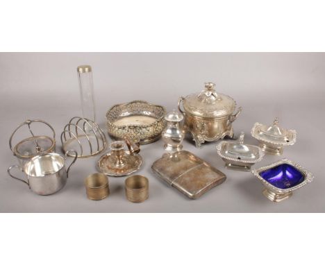 A box of silver plated items. Includes chamber stick, pots, toast rack etc.  