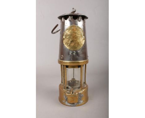 An Eccles Miners Lamp model no SL 23.( The Protector Lamp &amp; Lighting Co Ltd) H: 25cm.  Condition fair. A repair has been 