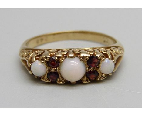 A 9ct gold, garnet and opal ring, 2.2g, I 