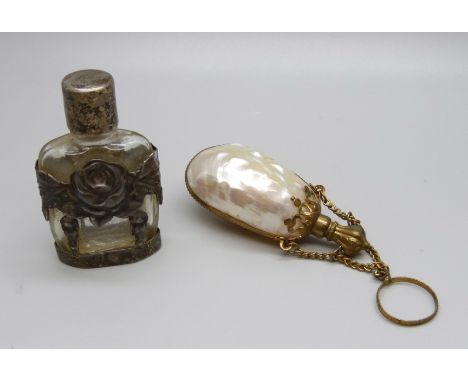 An Ari D Norman 925 silver mounted perfume bottle and a mother of pearl and gilt mounted scent bottle 