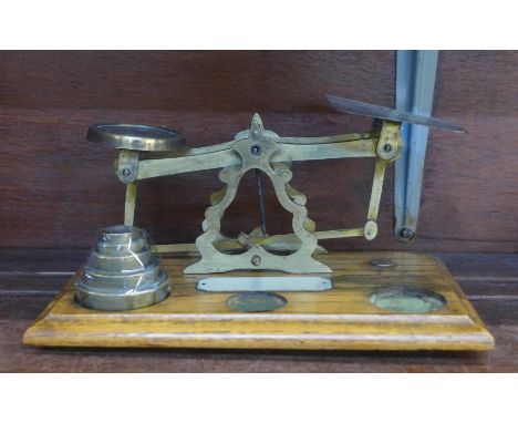 A set of postal scales, with weights, ivorine plaque 