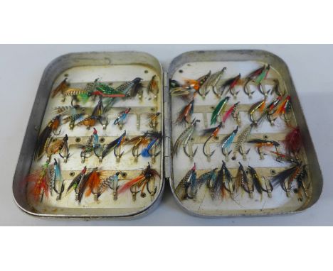 A tin of fifty-six vintage salmon flies 