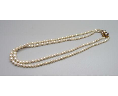 A double strand pearl necklace with 9ct gold clasp 