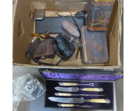 A four piece carving set, cased, a two piece fish knife and fork set and tins and four cameras, etc. 
