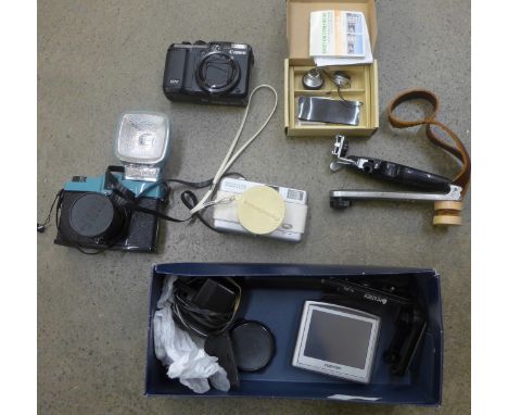 A Canon G10 digital camera, a Tom Tom sat nav and camera accessories 