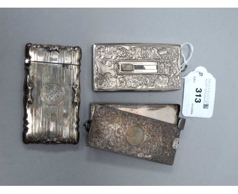 A Victorian Hallmarked Silver Sliding Card Case, (hallmarks rubbed), allover scrollwork decoration with vacant circular carto