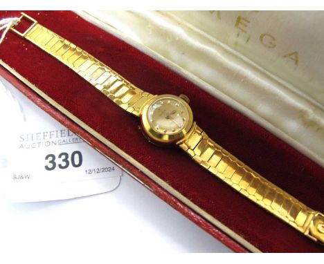 Omega; An 18ct Gold Cased Ladymatic Wristwatch, the signed dial with single stone diamond half pointers and dot markers, with