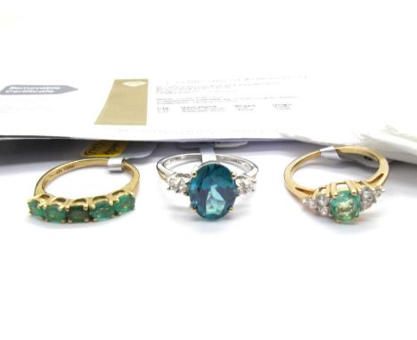 The Genuine Gemstone Company; A 9ct White Gold Teal Topaz & White Zircon Ring, oval claw set between two stone shoulders (fin