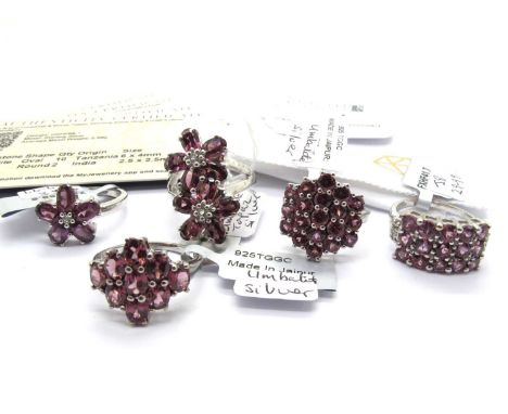 The Genuine Gemstone Company; A Collection of "925" Umbalite Set Rings, to include double flowerhead cluster, single floral c