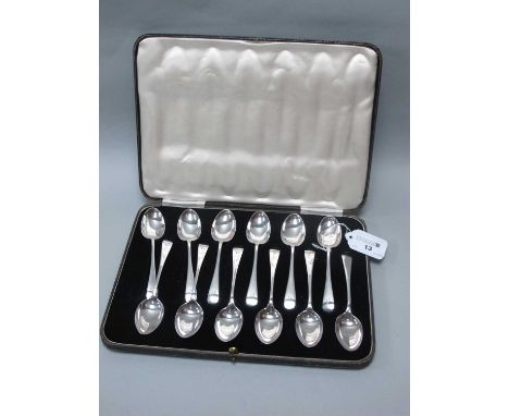 A Set of Twelve Hallmarked Silver Teaspoons, RR, Sheffield 1918, rattail pattern verso with engraved initial to terminal, wit