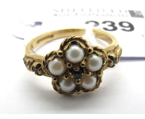 A Vintage 9ct Gold Pearl and Sapphire Cluster Ring, of flowerhead form, the five pearl bead surround set with sapphire centre