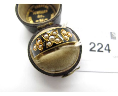 A Victorian 15ct Gold Seed Pearl Mourning Ring, the seed pearls collet set to floral setting, within enamel inlaid surround, 