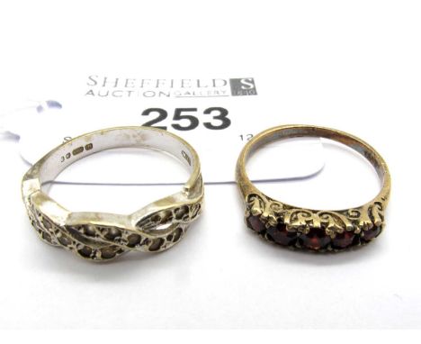 A 9ct White Gold Stone Set Crossover Ring, collet set throughout, between tapered band (finger size P), with a vintage five s