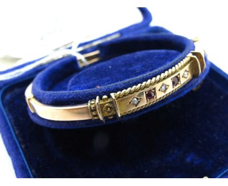 A 9ct Gold Circa Late XIX Century Old Cut Diamond and Stone Set Hinged Bangle, the alternate stones set within ropetwist bord