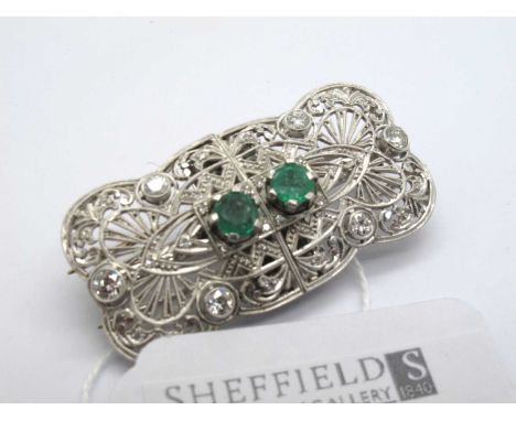 An Art Deco Style Emerald and Diamond Double Dress Clip / Brooch, of shaped rectangular form, the intricate openwork design w