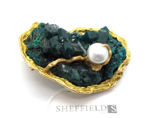 An Abstract Style Geode and Pearl Set Pendant Brooch, the rough geode stone set between abstract textured surround of bark fi