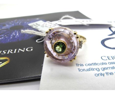 The Genuine Gemstone Company; A Lehrer Collection Amethyst, Tsavorite Garnet & Diamond TorusRing, double claw set between sto