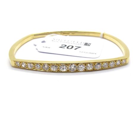 An 18ct Gold Fifteen Stone Diamond Set Bangle, of boat form, the brilliant cut diamonds of graduated size, claw set throughou