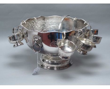 A Large Sheffield Silver Plated Punch Bowl, foliate scroll decoration with vacant cartouche, twin lion mask and ring handles,