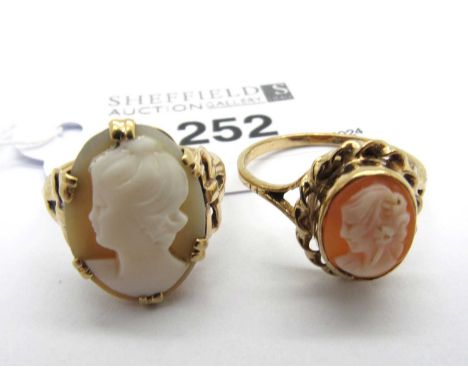 An Antique Style Carved Shell Cameo Ring, the oval panel depicting the portrait of a lady, double claw set between decorative