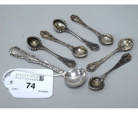 A Set of Six Decorative Salt Spoons, stamped "STERLING", together with a condiment spoon of scrollwork design, stamped "STERL