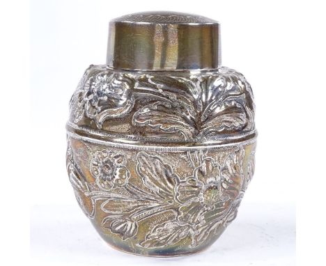 An Edwardian silver baluster tea caddy, with relief embossed floral decoration, by Pairpoint Brothers, hallmarks London 1905m