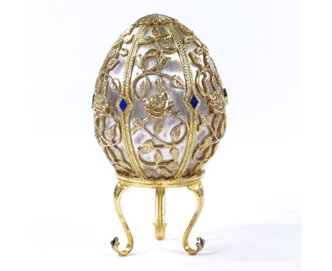 A Theo Faberge style St Petersburg Collection Egg - Emergence of Spring, silver and enamel egg, opening to reveal butterfly, 