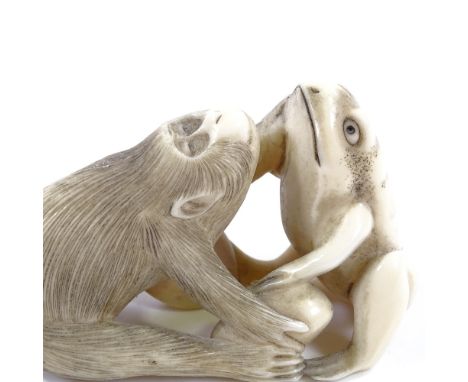 A Japanese Meiji Period carved ivory netsuke, in the form of a monkey and a frog, length 6.5cm 