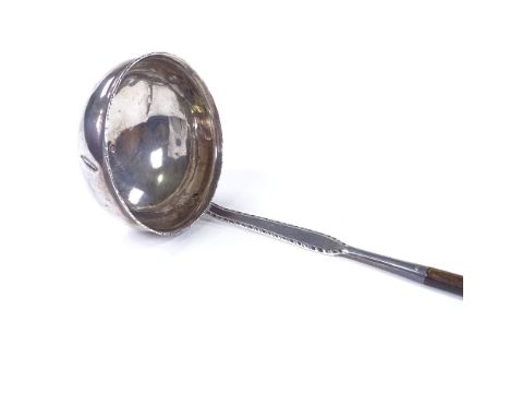 A Georgian silver toddy ladle, with twisted whale bone handle, maker's marks WS, length 31cm 